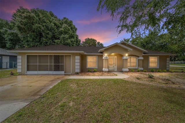 4886 NW 30th Pl, Ocala, FL 34482 - ranch-style house with stucco siding, a front lawn, and concrete driveway