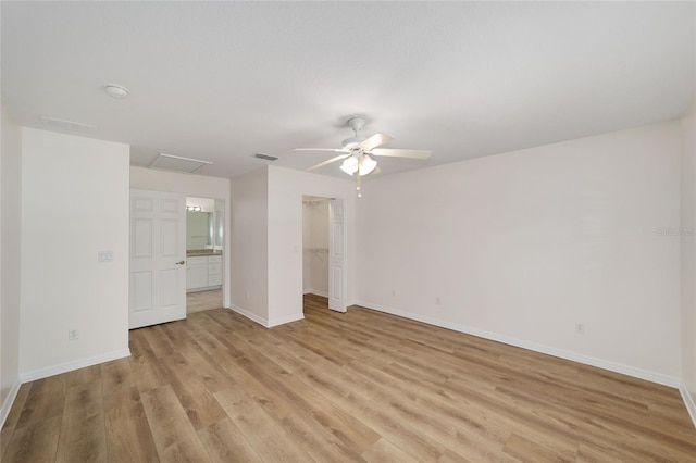 4886 NW 30th Pl, Ocala, FL 34482 - unfurnished bedroom featuring attic access, light wood-style floors, baseboards, and a ceiling fan