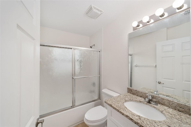 4886 NW 30th Pl, Ocala, FL 34482 - full bath featuring toilet, vanity, and combined bath / shower with glass door