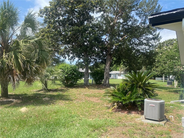 9920 SW 102nd Pl, Ocala, FL 34481 - view of green lawn featuring central AC