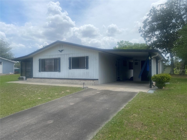 9920 SW 102nd Pl, Ocala, FL 34481 - ranch-style house featuring concrete driveway, a front yard, and a carport