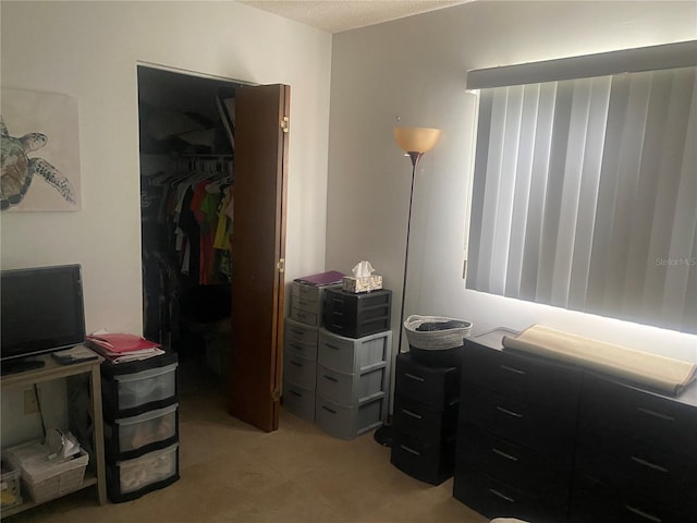 9920 SW 102nd Pl, Ocala, FL 34481 - bedroom with a closet and light tile patterned flooring