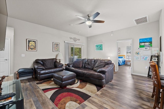 808 Overlook Grove Dr, Winter Haven, FL 33884 - living area featuring a ceiling fan, wood finished floors, and baseboards