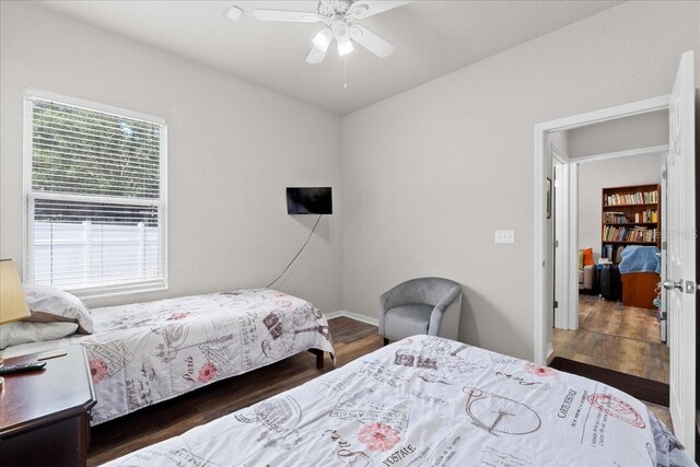 808 Overlook Grove Dr, Winter Haven, FL 33884 - bedroom featuring multiple windows, wood finished floors, ceiling fan, and baseboards