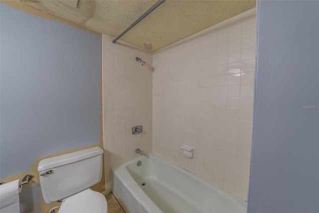 bathroom with toilet, bathtub / shower combination, and a textured ceiling