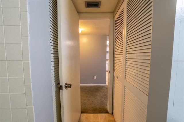corridor with carpet floors