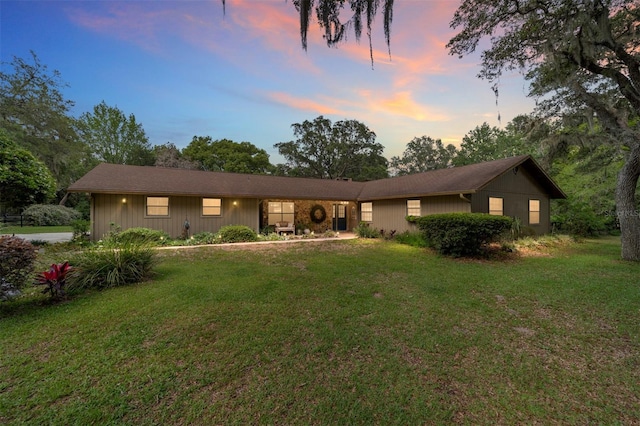 ranch-style house with a yard