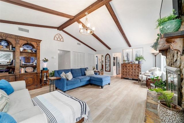 living room featuring beamed ceiling, a chandelier, light wood-style floors, and high vaulted ceiling