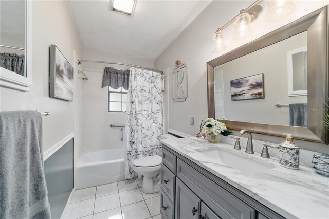 full bath featuring tile patterned floors, vanity, toilet, and shower / tub combo