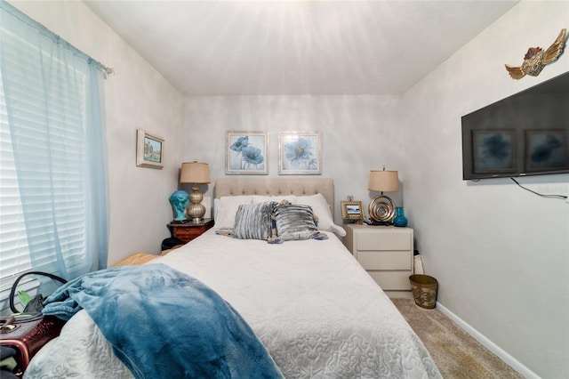 carpeted bedroom with baseboards