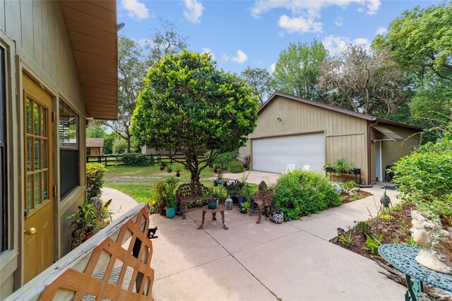 view of patio / terrace with a detached garage