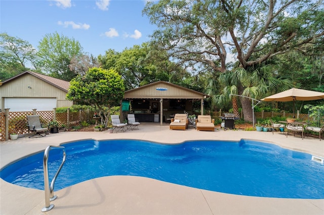 view of pool with fence, a patio area, grilling area, an outdoor hangout area, and an outdoor structure