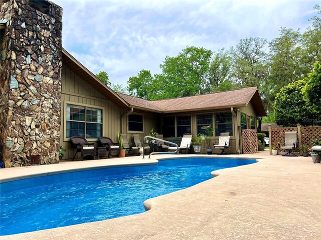 view of pool featuring a patio