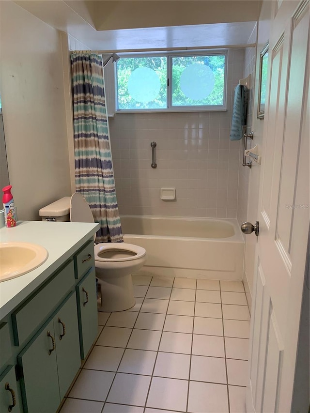 full bathroom with tile patterned floors, vanity, toilet, and shower / bathtub combination with curtain