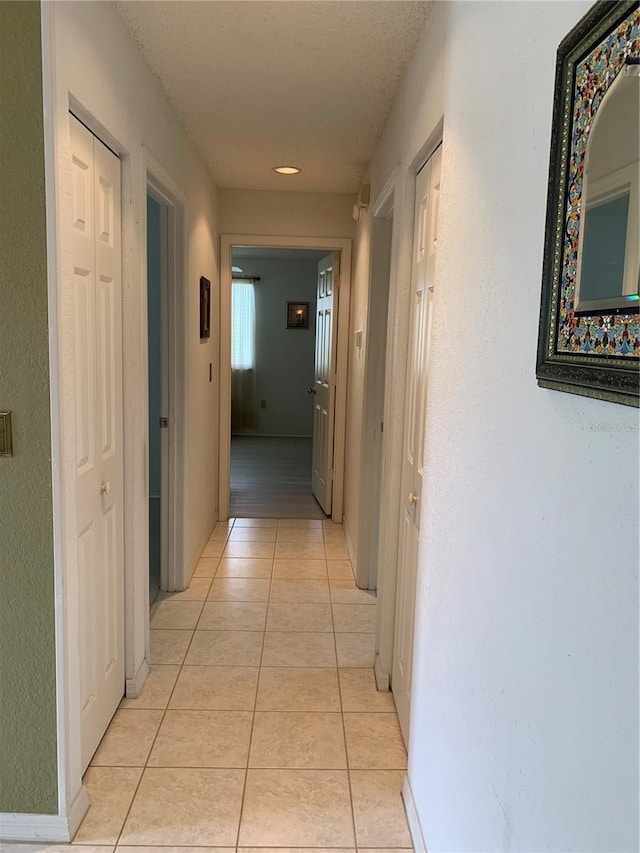 11445 SW 84th Avenue Rd, Ocala, FL 34481 - hallway with light tile patterned floors