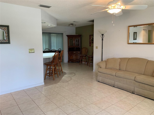 11445 SW 84th Avenue Rd, Ocala, FL 34481 - living area with a ceiling fan, light tile patterned floors, and a textured ceiling