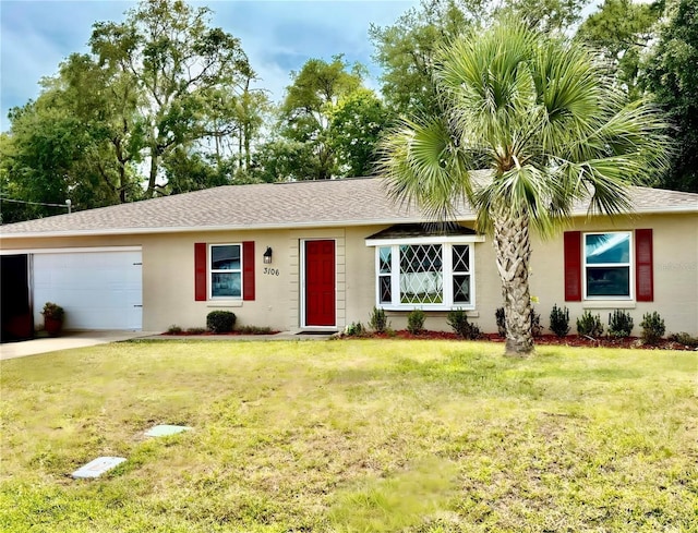 3106 Silver Palm Dr, Edgewater, FL 32141 - single story home featuring an attached garage, stucco siding, a front yard, a shingled roof, and driveway