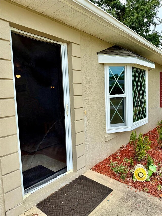 3106 Silver Palm Dr, Edgewater, FL 32141 - doorway to property featuring stucco siding