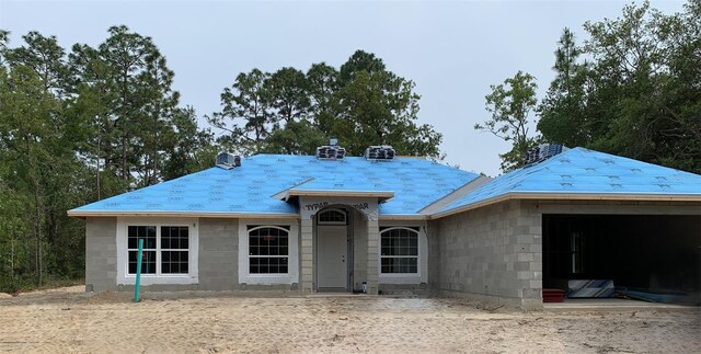 view of front of house with concrete block siding