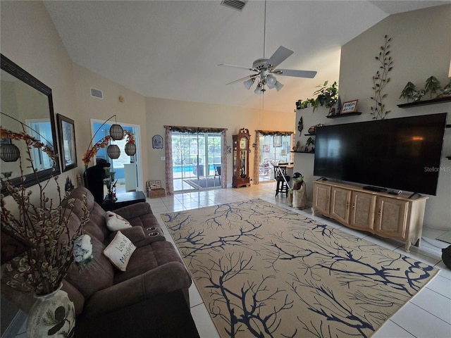 living room featuring light tile patterned floors, a ceiling fan, and high vaulted ceiling
