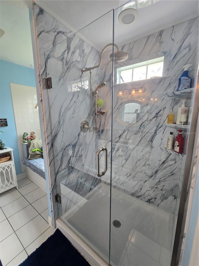 full bathroom featuring a marble finish shower and tile patterned floors