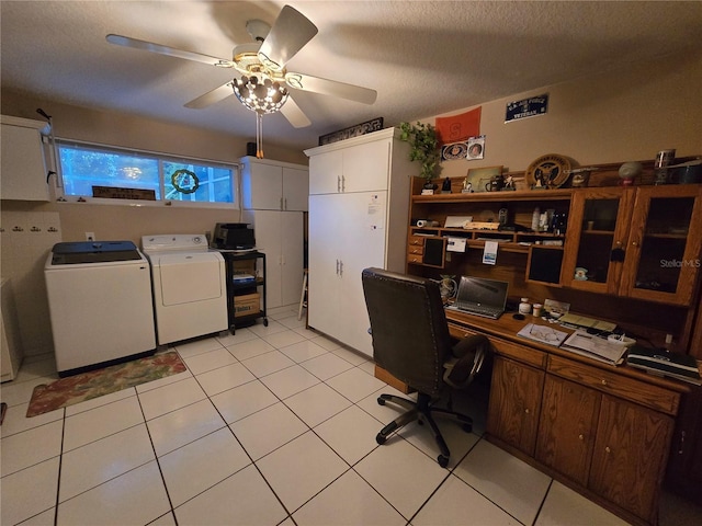 office space featuring a ceiling fan, independent washer and dryer, light tile patterned flooring, and a textured ceiling