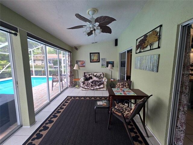 sunroom / solarium with tile patterned flooring