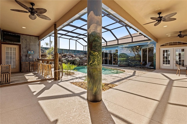 4725 County Road 121d, Wildwood, FL 34785 - view of patio with ceiling fan, french doors, an outdoor pool, and glass enclosure