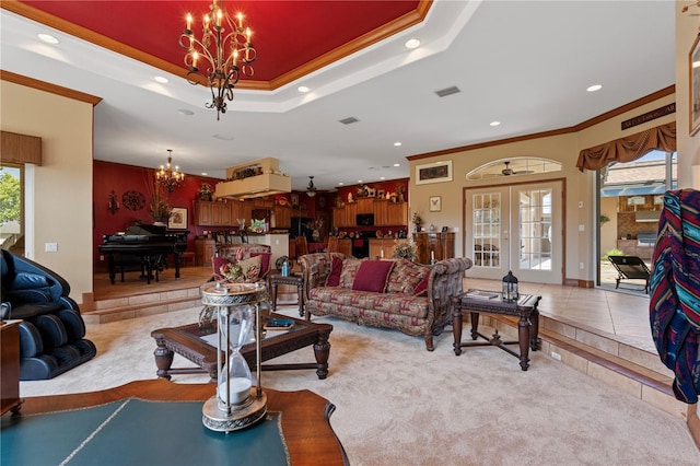4725 County Road 121d, Wildwood, FL 34785 - carpeted living area with a chandelier, ornamental molding, recessed lighting, plenty of natural light, and french doors