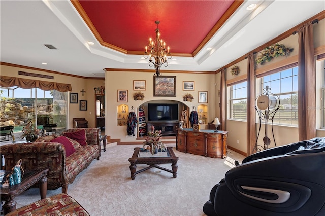 4725 County Road 121d, Wildwood, FL 34785 - living room featuring ornamental molding, light carpet, a tray ceiling, baseboards, and a chandelier