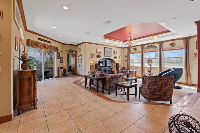 4725 County Road 121d, Wildwood, FL 34785 - living area with baseboards, light tile patterned floors, a tray ceiling, a chandelier, and crown molding