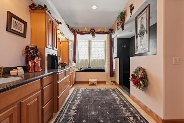 4725 County Road 121d, Wildwood, FL 34785 - bathroom with double vanity, tile patterned floors, and baseboards