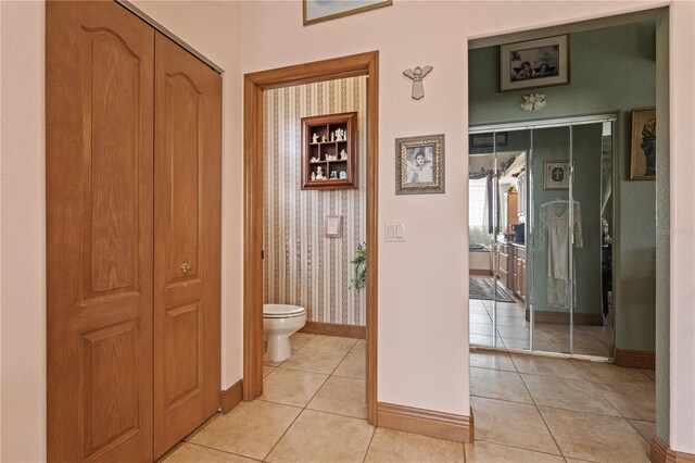 4725 County Road 121d, Wildwood, FL 34785 - corridor with baseboards and light tile patterned floors