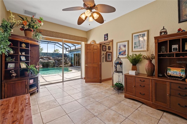 4725 County Road 121d, Wildwood, FL 34785 - living area featuring ceiling fan, a sunroom, and light tile patterned floors