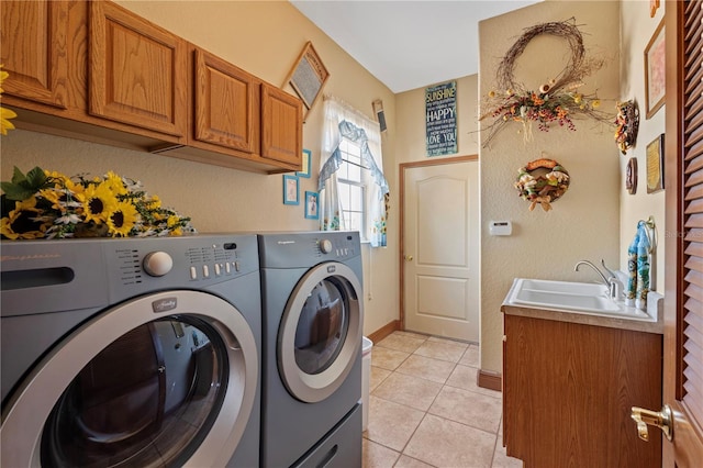 4725 County Road 121d, Wildwood, FL 34785 - laundry area featuring independent washer and dryer, cabinet space, light tile patterned flooring, and baseboards