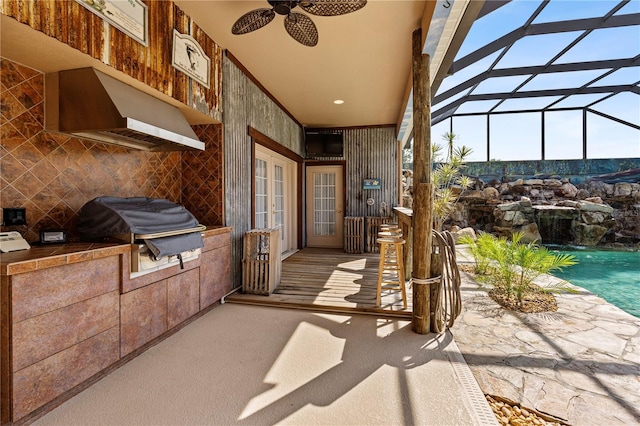 4725 County Road 121d, Wildwood, FL 34785 - view of patio featuring exterior kitchen, french doors, ceiling fan, area for grilling, and a lanai