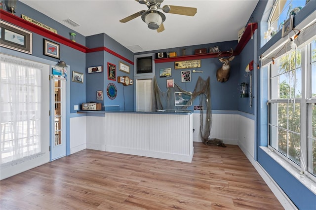 4725 County Road 121d, Wildwood, FL 34785 - reception with a wainscoted wall and ceiling fan