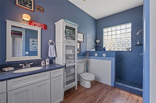 4725 County Road 121d, Wildwood, FL 34785 - bathroom with toilet, wood finished floors, vanity, and a shower