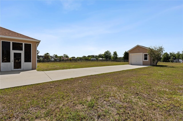 4725 County Road 121d, Wildwood, FL 34785 - view of yard with an outdoor structure, driveway, and a garage