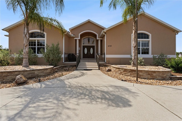 4725 County Road 121d, Wildwood, FL 34785 - view of front of house featuring stucco siding