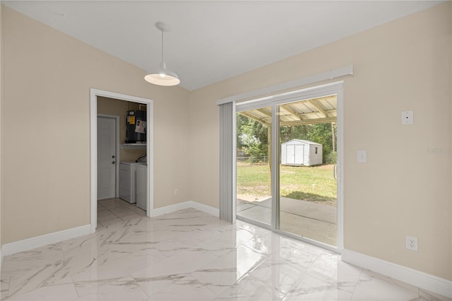 unfurnished dining area featuring water heater, washer and dryer, baseboards, and light marble finish flooring