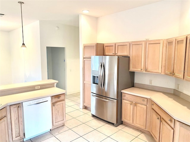 1402 Arredondo Dr, The Villages, FL 32162 - kitchen with white dishwasher, stainless steel fridge with ice dispenser, light brown cabinetry, light tile patterned floors, and light countertops
