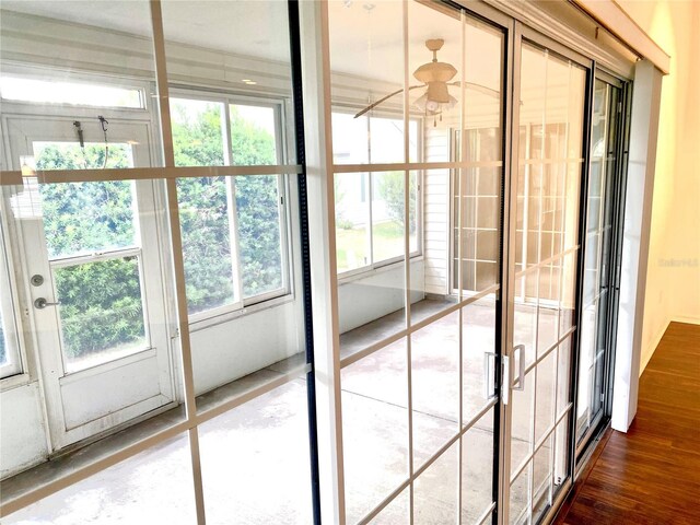 1402 Arredondo Dr, The Villages, FL 32162 - unfurnished sunroom featuring healthy amount of natural light and french doors