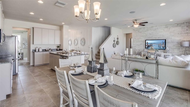 17922 NW 173rd Rd, Alachua, FL 32615 - dining area featuring ceiling fan, recessed lighting, stairway, a chandelier, and light tile patterned floors
