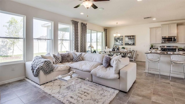 17922 NW 173rd Rd, Alachua, FL 32615 - living room with ceiling fan, baseboards, a chandelier, and recessed lighting