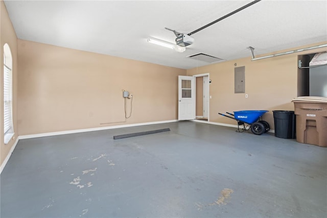 garage featuring baseboards, a garage door opener, and electric panel