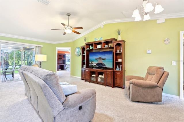 carpeted living room featuring ornamental molding, vaulted ceiling, ceiling fan, a chandelier, and baseboards