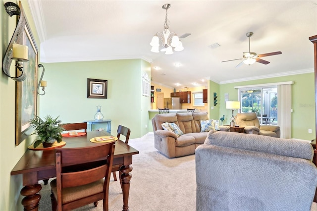 living area featuring crown molding, carpet, a chandelier, ceiling fan, and vaulted ceiling