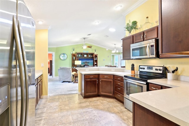 kitchen with appliances with stainless steel finishes, a peninsula, light countertops, open floor plan, and ornamental molding