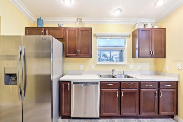 kitchen featuring appliances with stainless steel finishes, a sink, light countertops, crown molding, and reddish brown cabinets